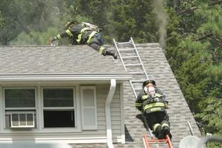 Structure Fire - Magnolia Rd. 07/11/08  Dist 9 FF's vent the roof